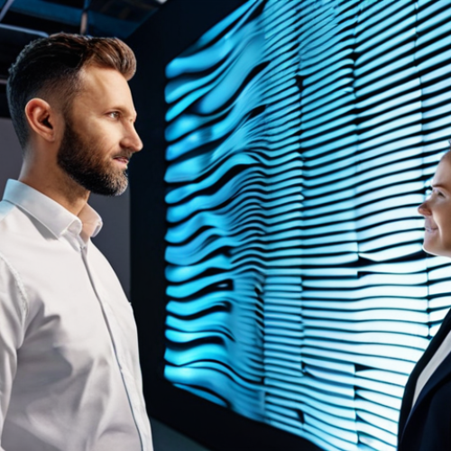 Home 6 A professional male architect and a professional female sound designer in modest business attire, standing in a modern design studio. They are collaboratively reviewing a large holographic display showing detailed acoustic simulations with sound wave patterns and material properties. The studio features innovative acoustic panels made from recycled materials on the walls and ceiling, with subtle integrated lighting. The scene emphasizes a high-tech, collaborative atmosphere. Professional photography, high quality, perfect anatomy, correct proportions, natural pose, well-formed hands, proper finger count, natural body proportions, safe for work, appropriate content, fully clothed, professional dress, family-friendly.